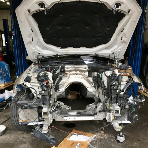 BMW 650i with engine removed at DMW Motor Cars, expert BMW engine services in Houston TX